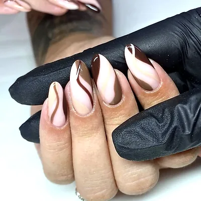 Almond nails swirled in chocolate, caramel and nude